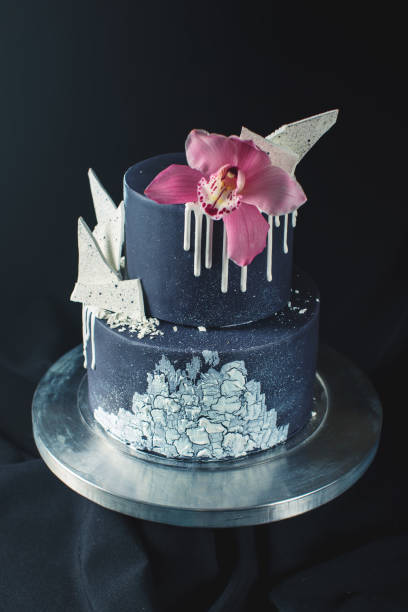 istock Black Wedding cake decorated with white chocolate and Orchid flower 646062288