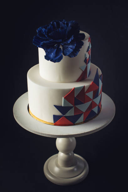 istock Beautiful wedding cake decorated with large blue rose on top 646062382