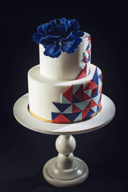 istock Beautiful wedding cake decorated with large blue rose on top 646062384