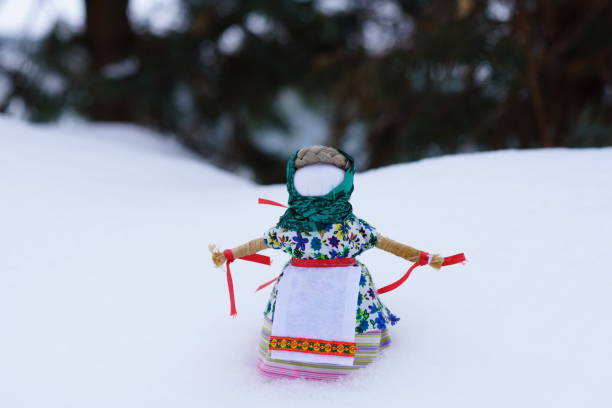 carnival doll for the burning festivities in the winter Maslenitsa in the snow