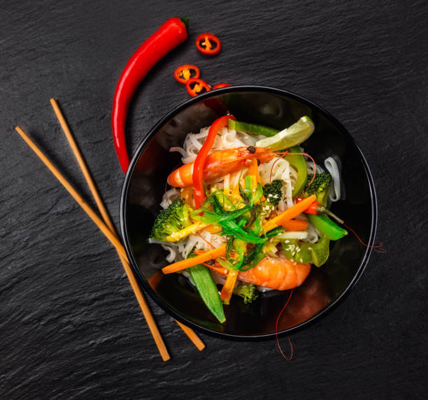 istock Asian chicken curry and prawns with rice 646064966
