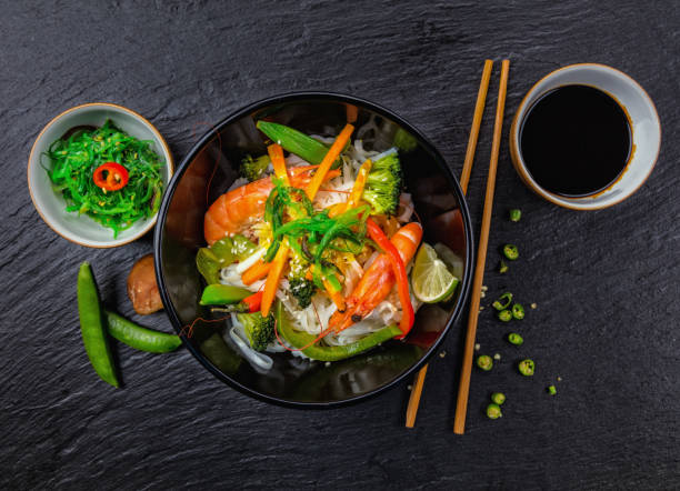 istock Asian chicken curry and prawns with rice 646064992
