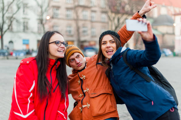 istock Friends traveling and taking photos 646065064