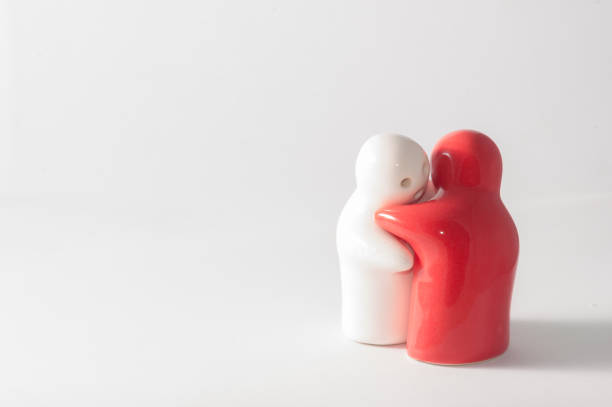 istock Ceramic doll red and white feeling hug in white background. 646065598