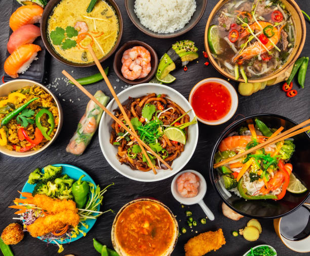 istock Asian food served on black stone, top view 646067690