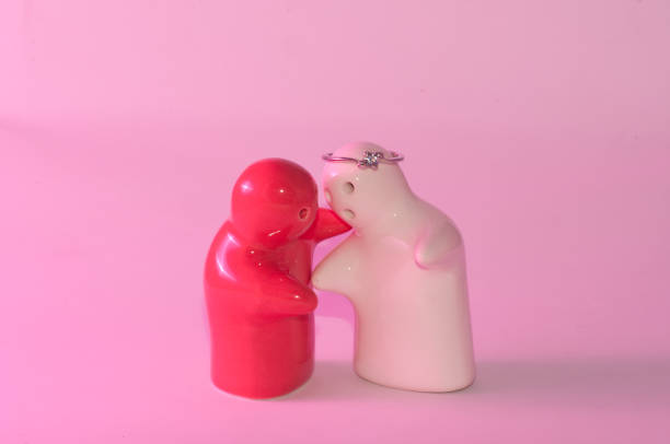 istock Ceramic doll red and white wedding ring overhead feeling hug 646067722