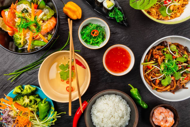 istock Asian food served on black stone, top view 646067820