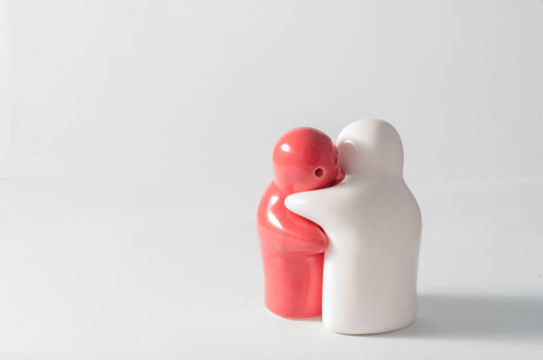 istock Ceramic doll red and white feeling hug in white background. 646068324
