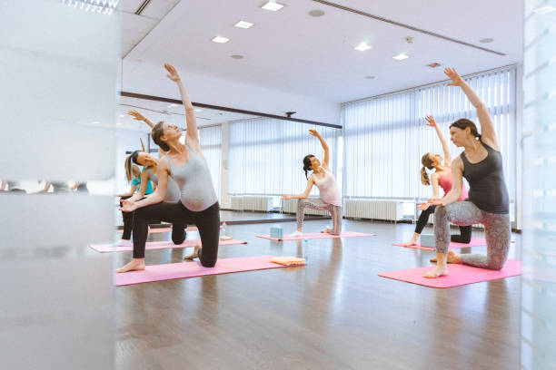 istock Pregnant women on a yoga class 646071090