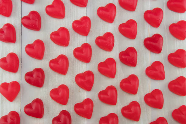 istock Wide View of Red Gummy Hearts at Angle 646071958