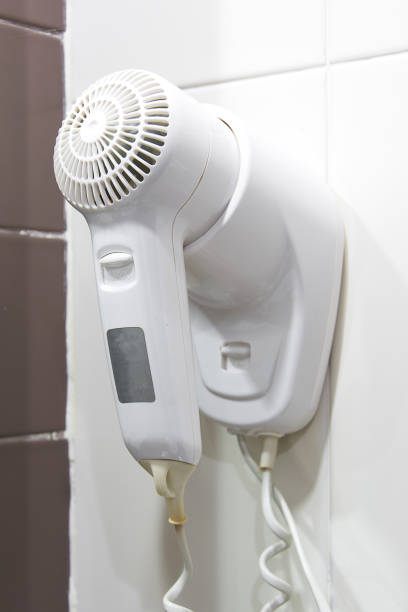 istock Hair dryer in bathroom 646072566