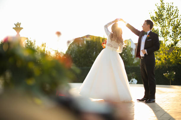 istock Lovely bride and groom outside 646078688