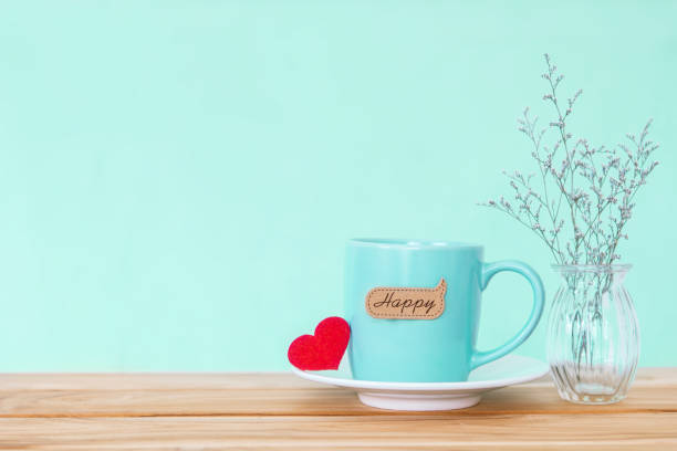 istock Coffee cup mug with red heart shapeand happy word tag 646078702