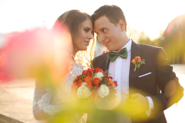 istock Lovely bride and groom outside 646085192