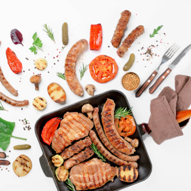 istock Different food grilled in a cast iron grill pan on a white background 646085574