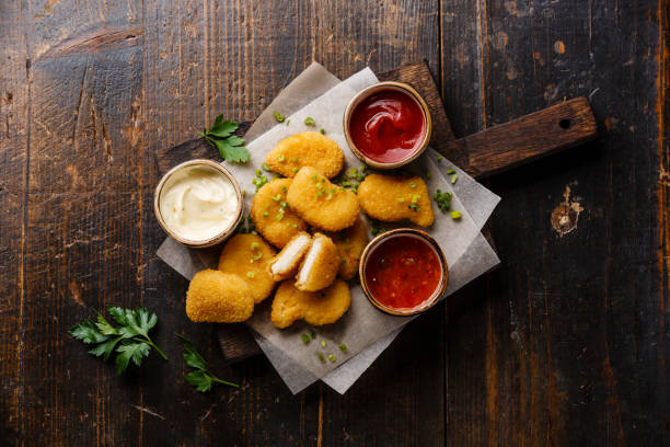 istock Chicken breast nuggets with sauces 646088450