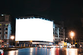 Blank billboard on building at night