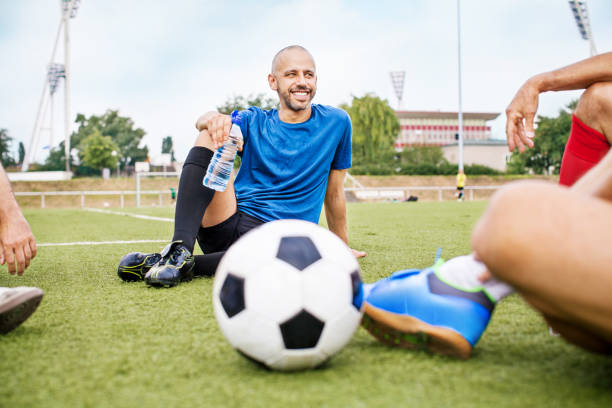 istock Senior soccer players resting after a match 646102594