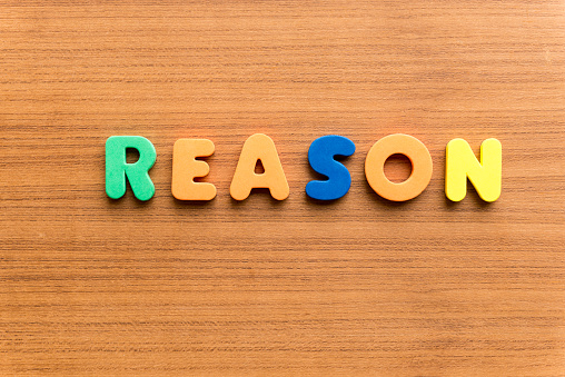 reason colorful word on the wooden background