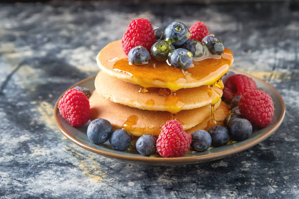 istock Stack of pancakes with fresh blueberry and maple syrup 646102668