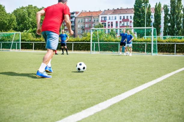 istock Senior men are playing soccer 646102710
