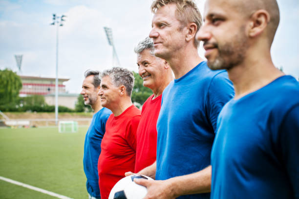 istock Senior soccer players standing in a row before the match 646105180