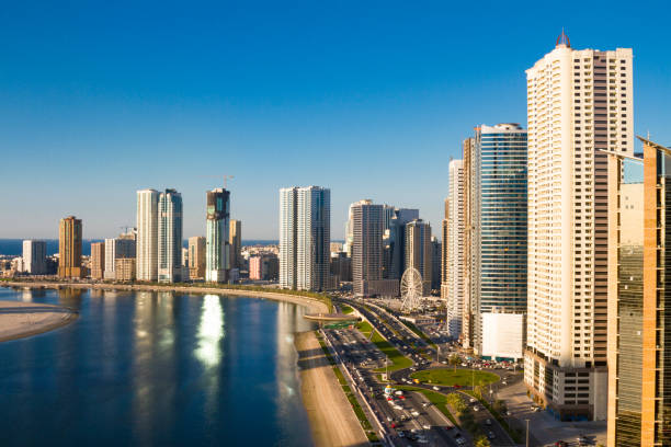 Sharjah, Al Mamzar lake corniche Watefront at the Corniche by Al Mamzar Lake, Sharjah, UAE. sharjah city stock pictures, royalty-free photos & images