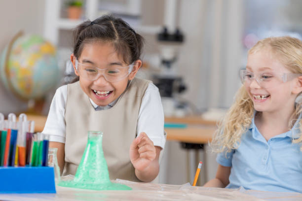 istock Cheerful young chemistry students have fun with science experiment 646117522