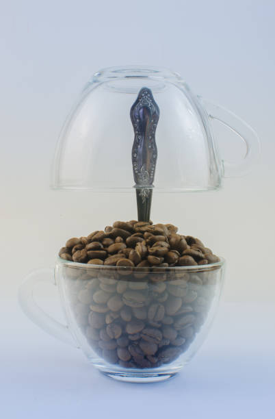istock Coffee beans in transparent mugs 646121132