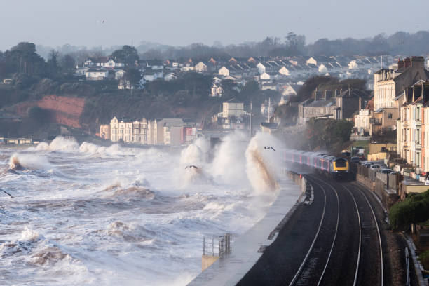 istock Intercity train getting a soaking past Dawlish station in storm 646121220