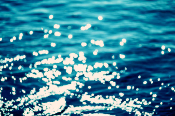 istock Summer Background / Abstract blue  water background with lens flare 646121454