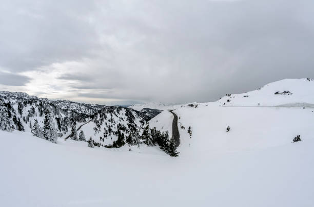 French Alps winter panoramic view high up in the snowy mountains of the Trois Vallees ski area during the winter skiing season near Val Thorens in the Savoie department, France.
