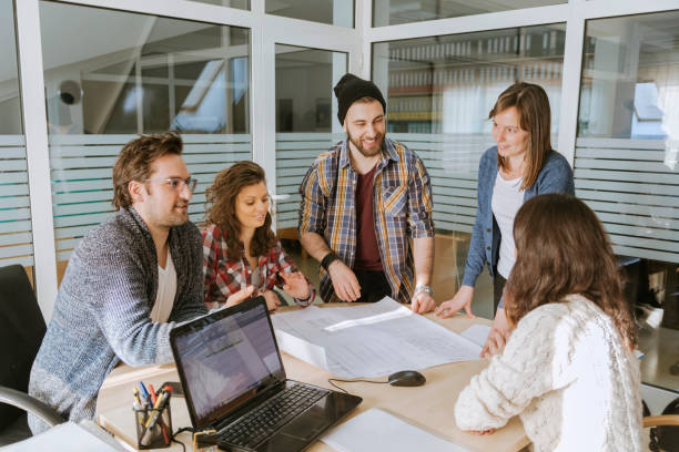 istock Start Up Team Of Freelancers In The Office 646128480