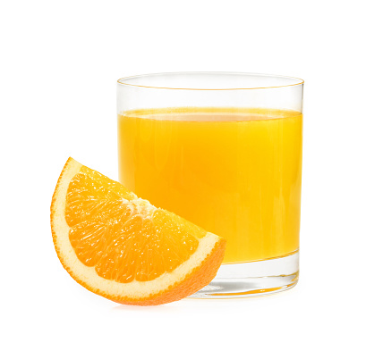 Front view view of orange fruit and glass of orange juice on white background.