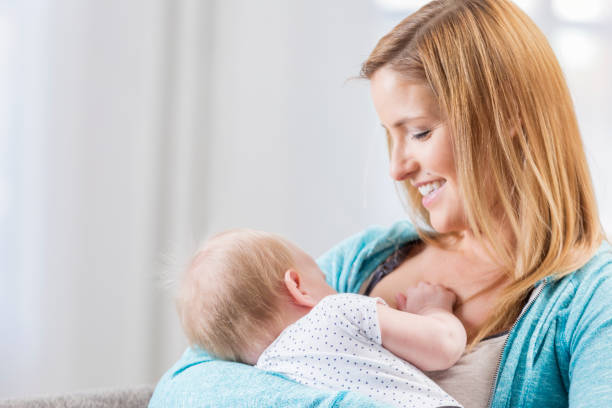 istock Loving mom breastfeeds baby 646136012