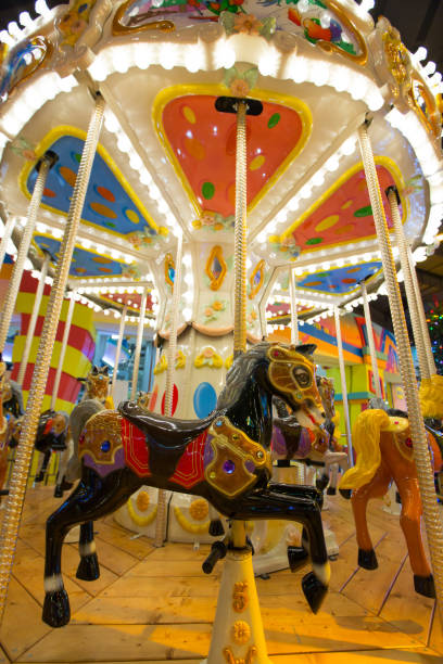 istock Carousel with horses in theme park. 646136136