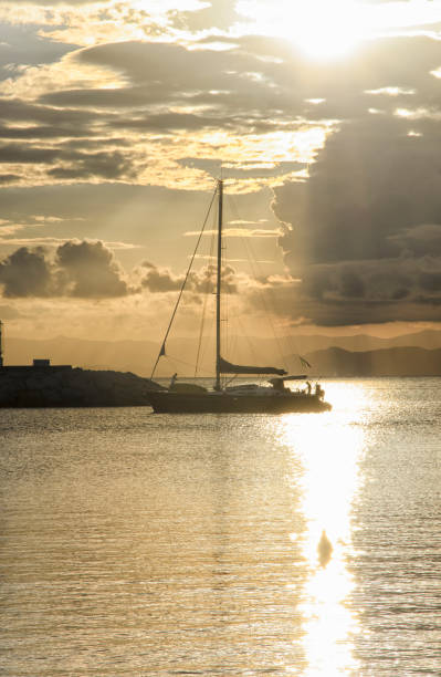 istock Sailing ship crossing the sun glitter 646141812
