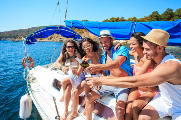 istock Friends cheering with champagne on yacht 646143348
