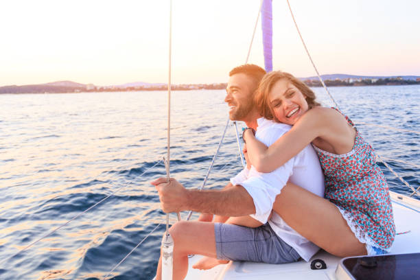 istock Couple having romantic trip with yacht in sea 646143396