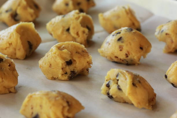 istock Cookie dough on a tray before into the oven. 646143664