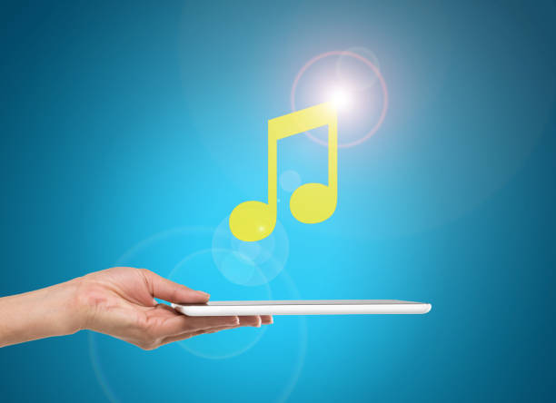 istock Businesswoman using musical note icon on digital tablet 646143798