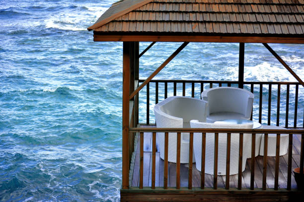 Sea-side arbor and white seating group.