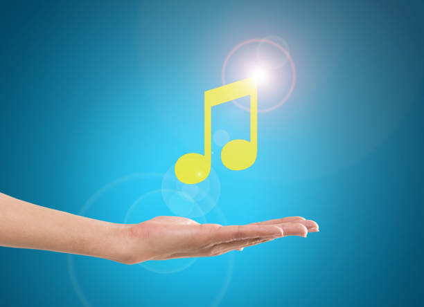 istock Businesswoman hand holding musical note icon 646143946