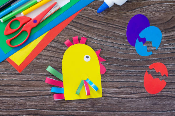 istock Easter greetings card handcrafted Cockerel and eggs. Children's Art Project, needlework, crafts for children. Craft for kids. 646146704