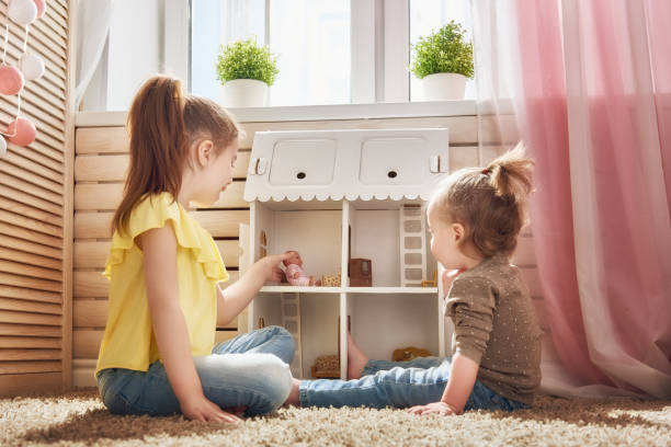girls play with doll house