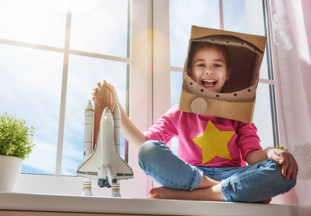 istock girl in an astronaut costume 646151140