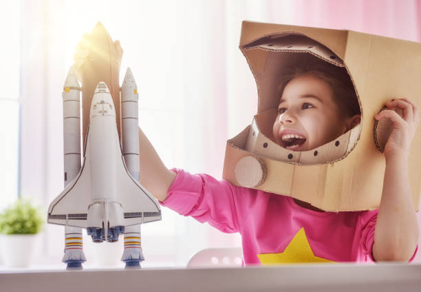 istock girl in an astronaut costume 646151182