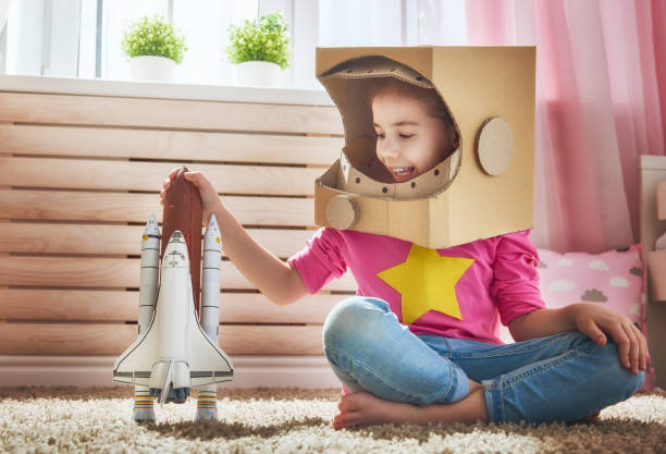 istock girl in an astronaut costume 646151208