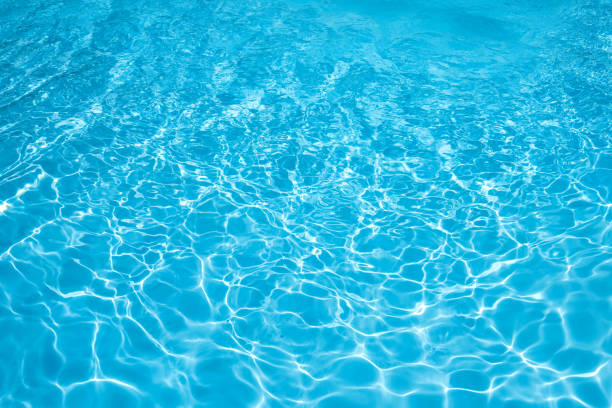 istock Blue and bright ripple water and surface in swimming pool 646164820