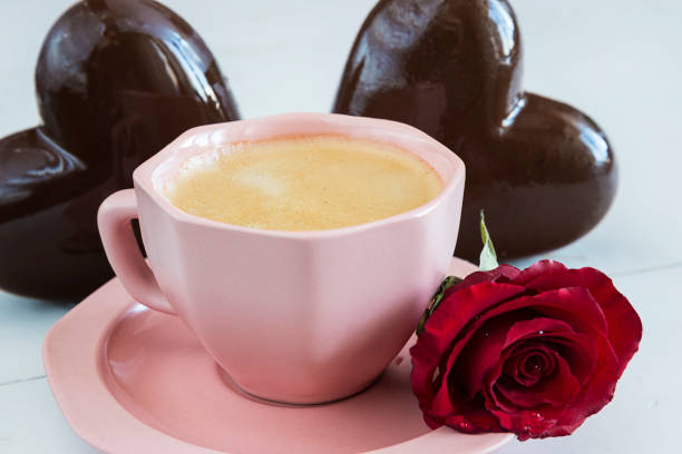 istock coffee cup and chocolate hearts and red rose flower 646167710
